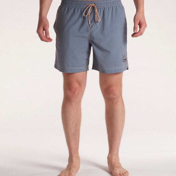 The reflection blue board shorts on a front facing model