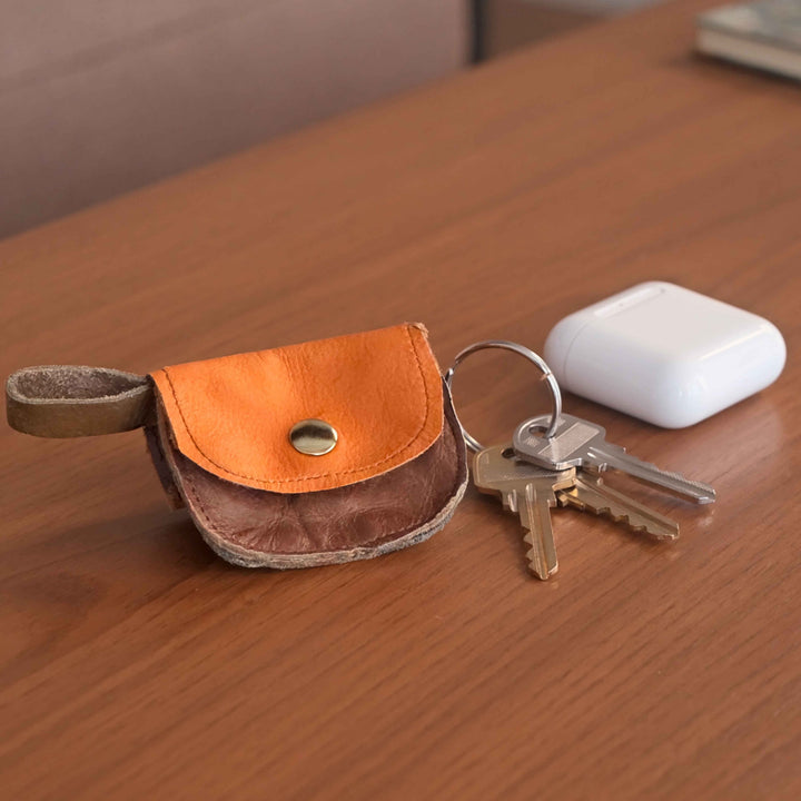 Orange and tan leather change pouch