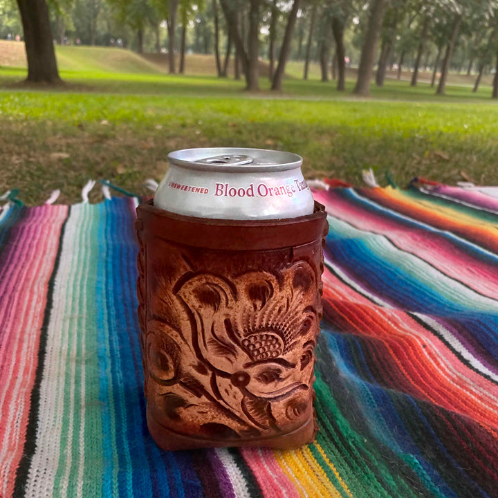 Tooled leather can sleeve as western bar decor
