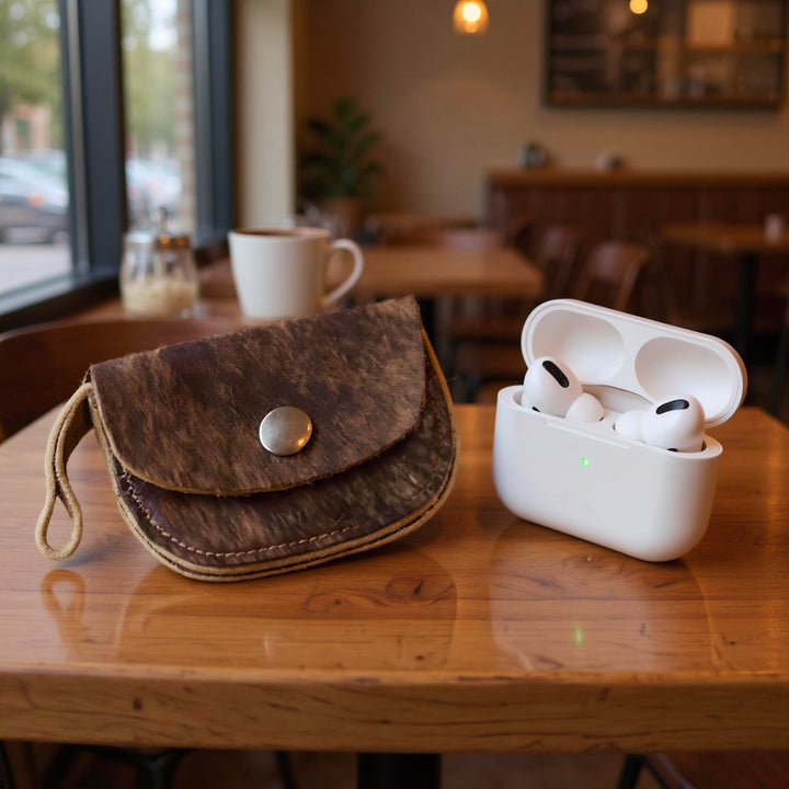 Brown hair-on cowhide AirPods case with snap closed