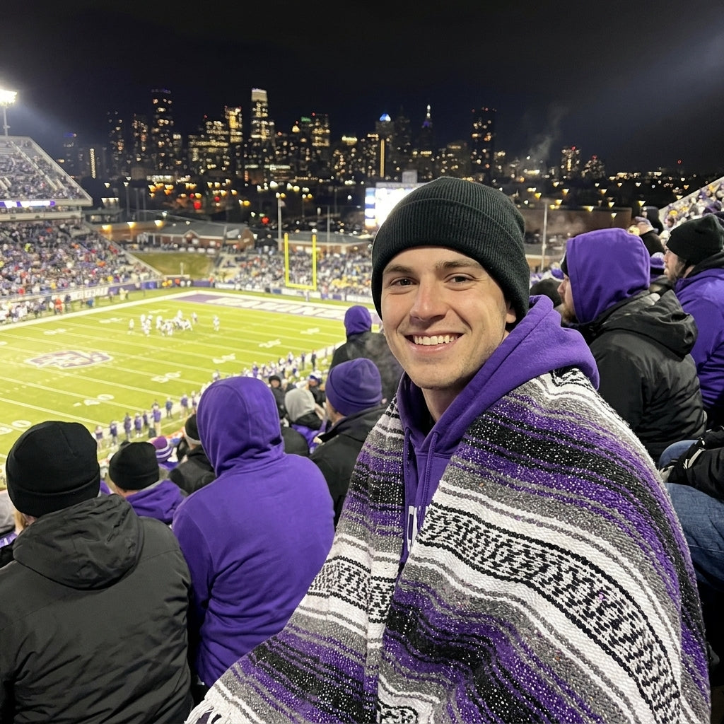 Fan wrapped in a Mexican stadium blanket at a Baltimore football game