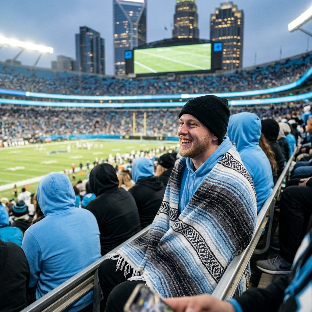 Fan wrapped in a Mexican stadium blanket at a Charlotte football game