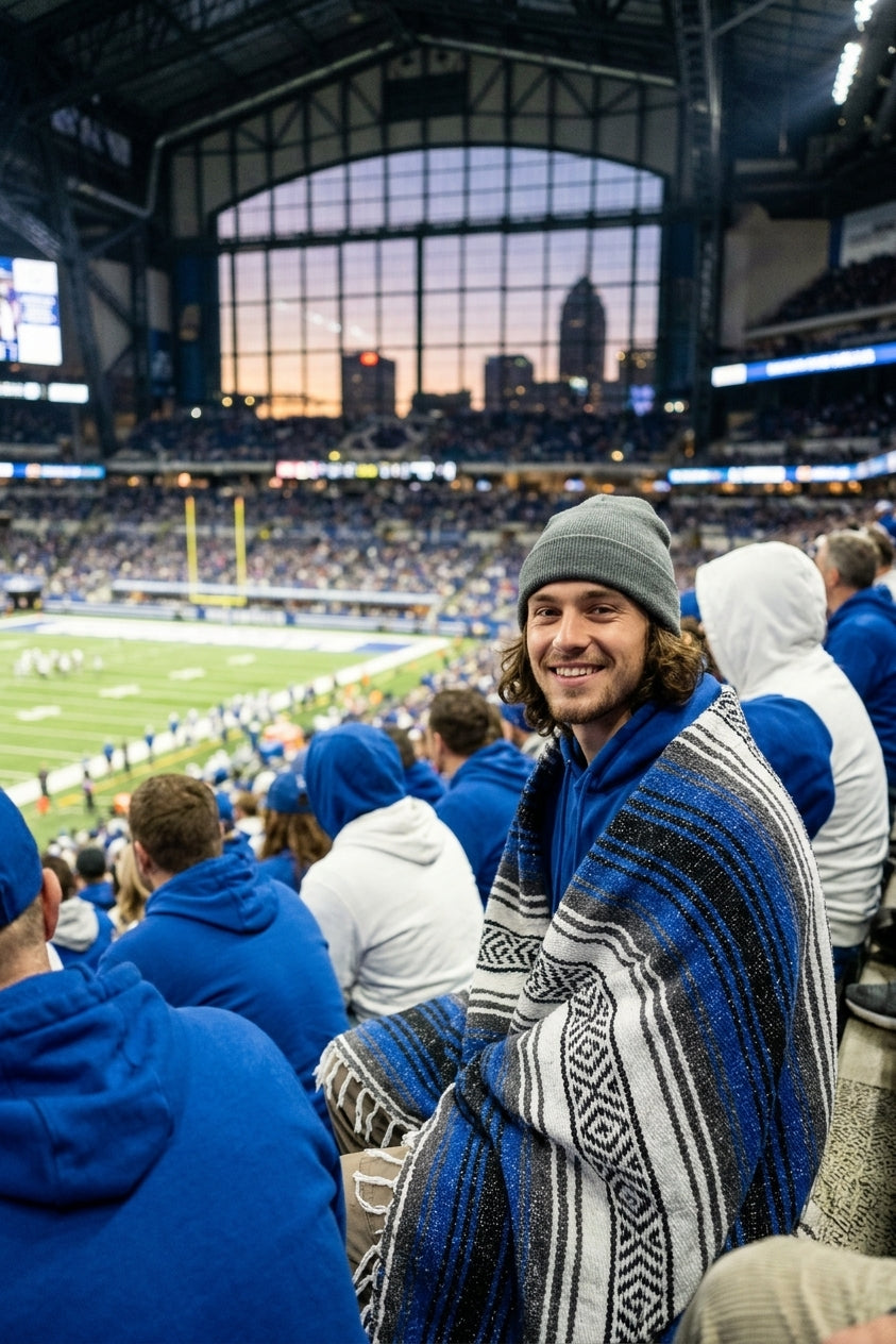 Fan wrapped in a Mexican stadium blanket at an Indianapolis football game