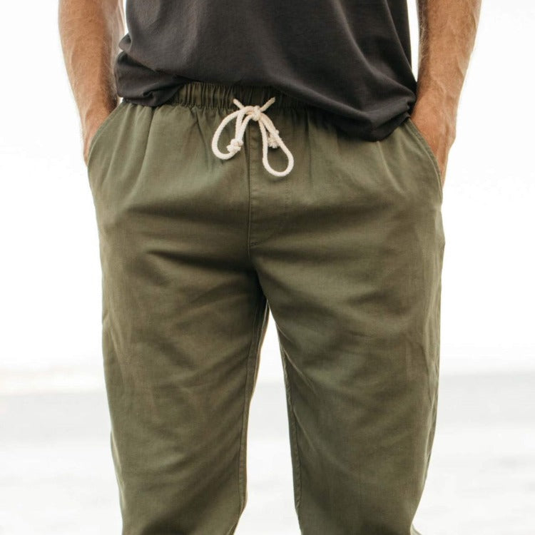 Men's joggers in faded green by Mollusk 