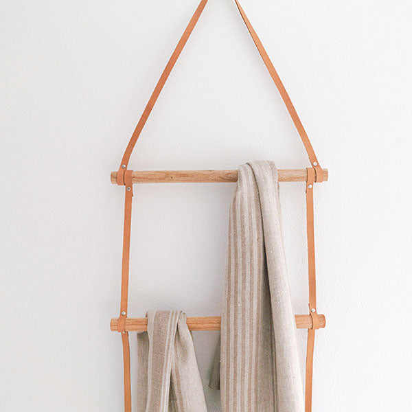 leather and wood blanket ladder